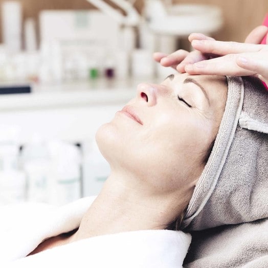 Woman receives cosmetic treatment on wellness holiday in Windischgarsten