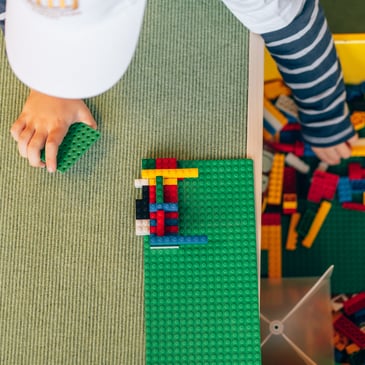 Child with Lego bricks