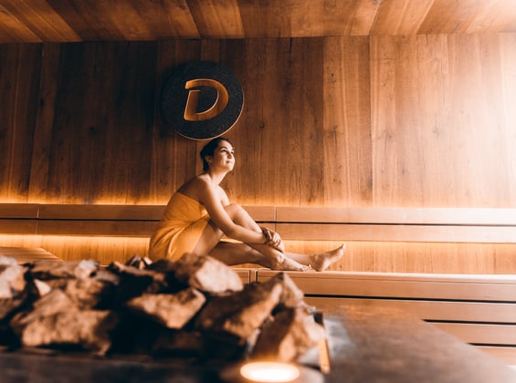 Woman with a towel in a sauna at Burgtherme