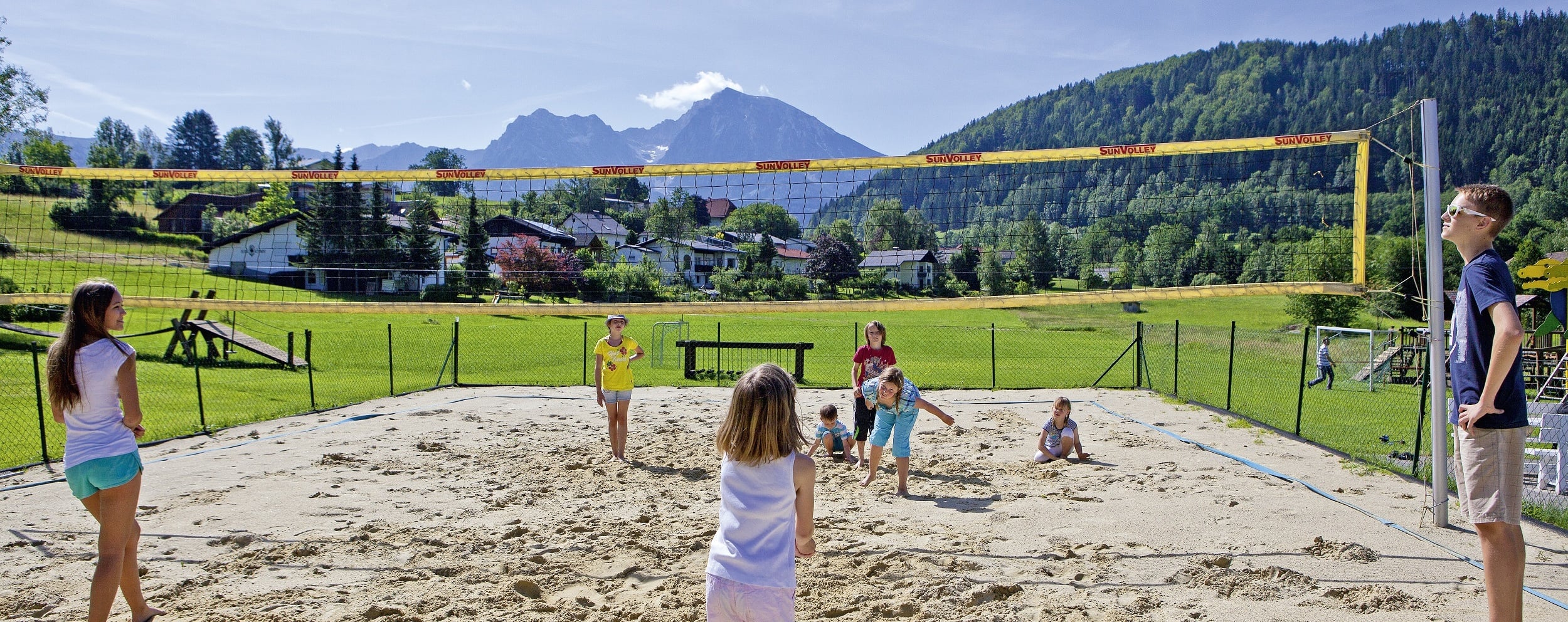 Children play volleyball