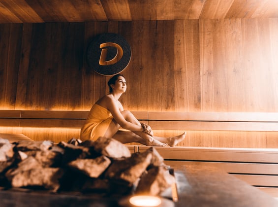 Woman with a towel in a sauna at Burgtherme