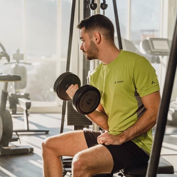 Man with a dumbbell in the gym