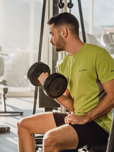 Man with a dumbbell in the gym