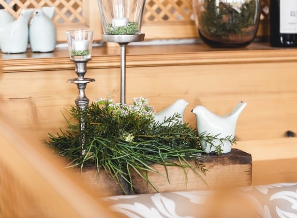 Candlesticks & sustainable decorations made from fir branches & grasses adorn the Hotel Dilly